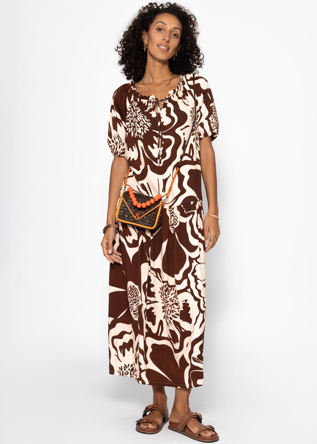 Volant dress with a large floral pressure - brown