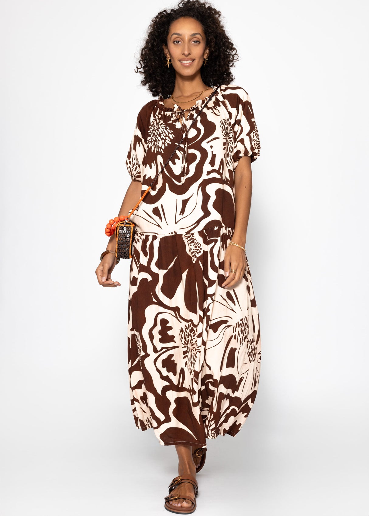 Volant dress with a large floral pressure - brown