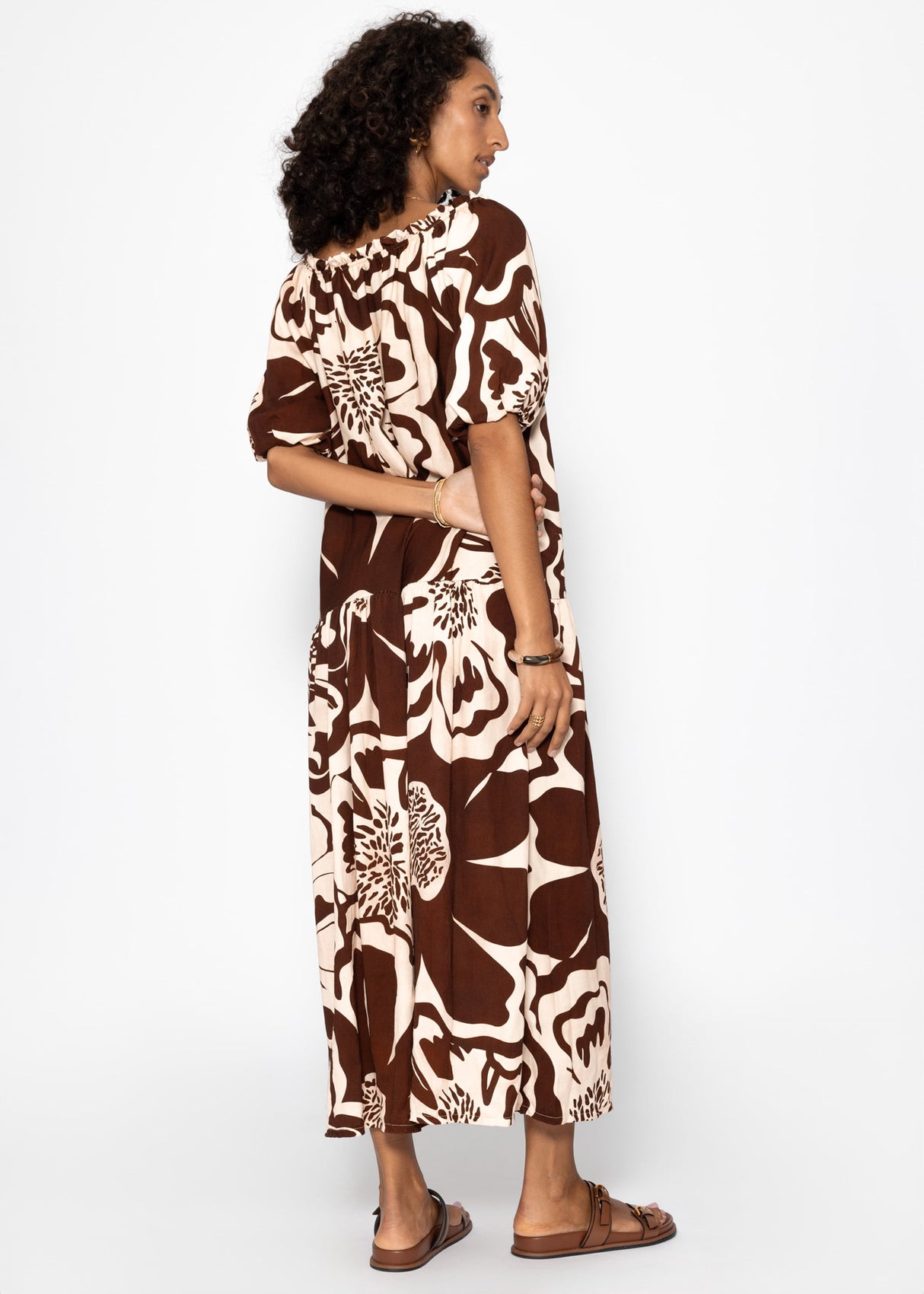 Volant dress with a large floral pressure - brown