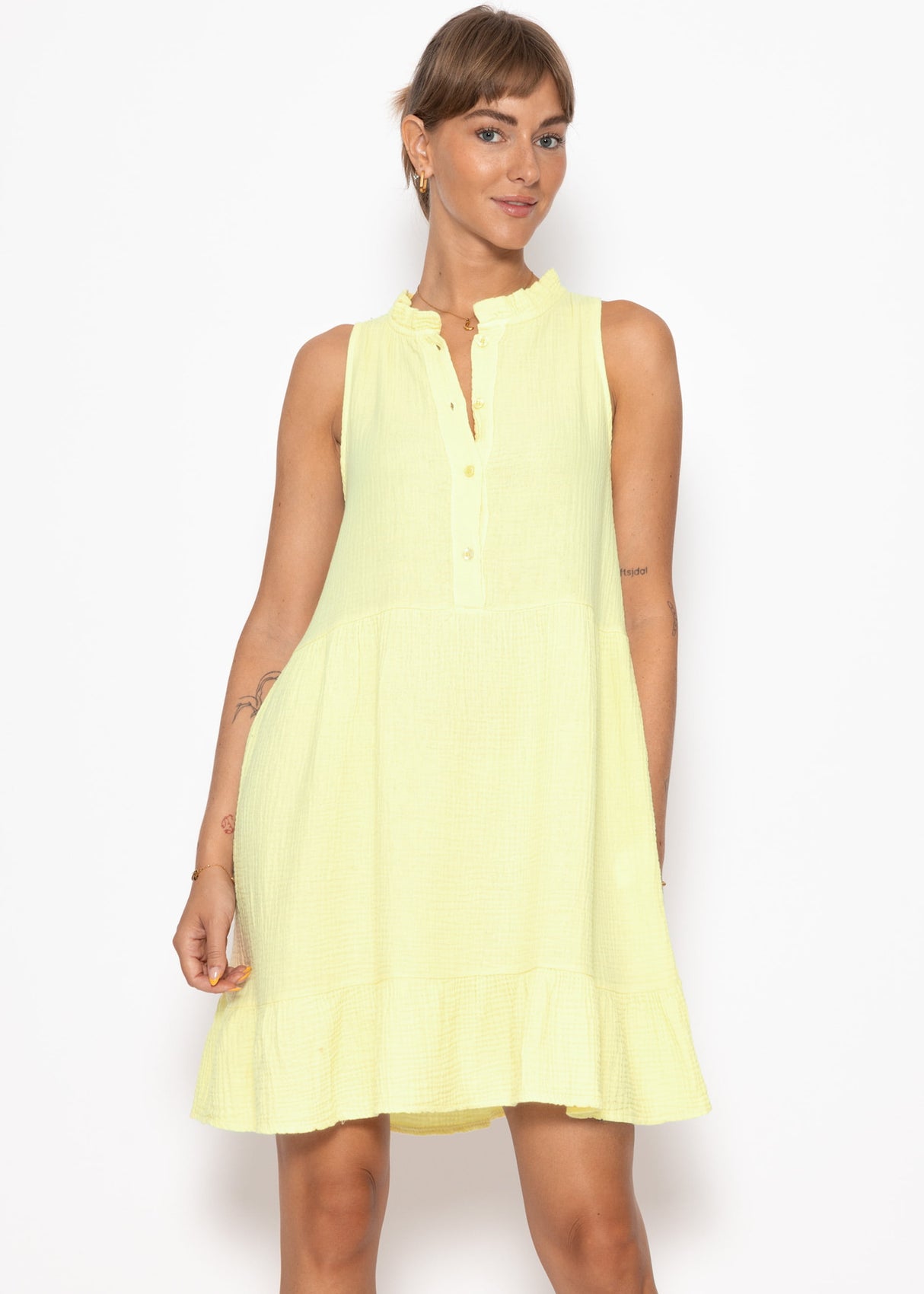 Small Musselin dress with ruffles - butter yellow
