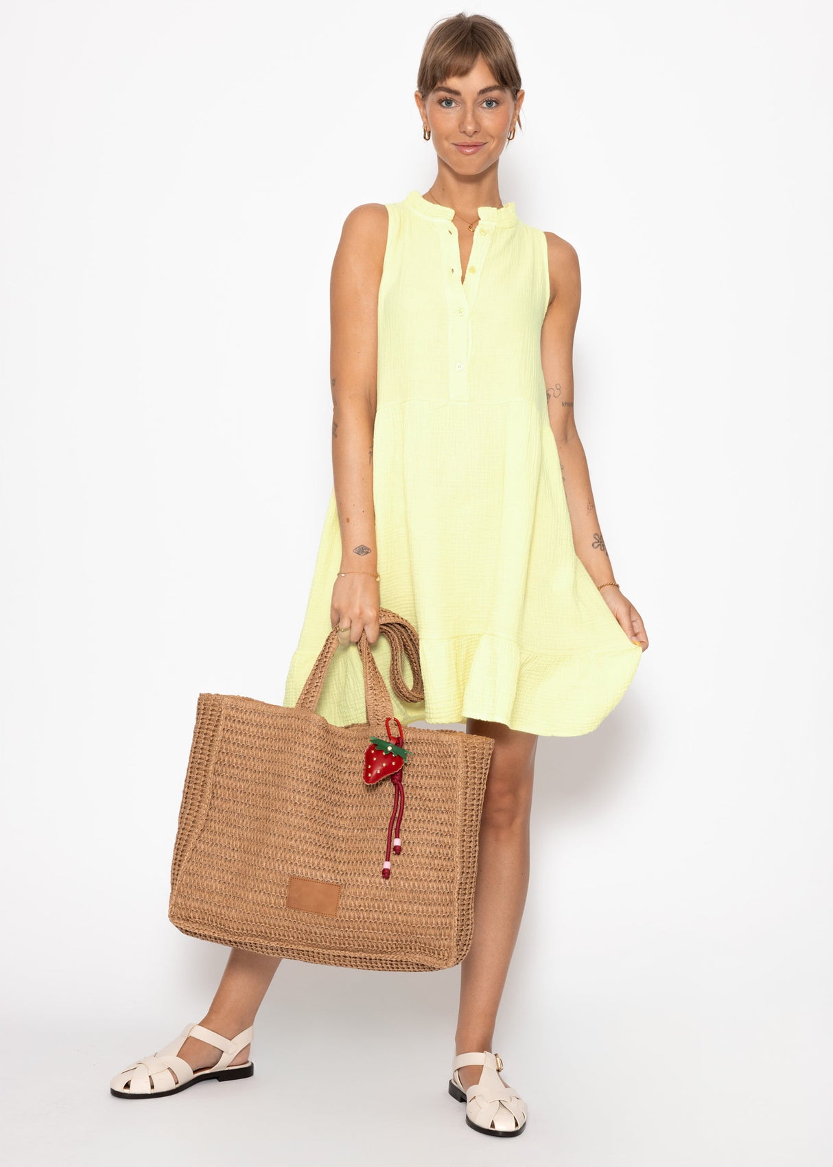 Small Musselin dress with ruffles - butter yellow