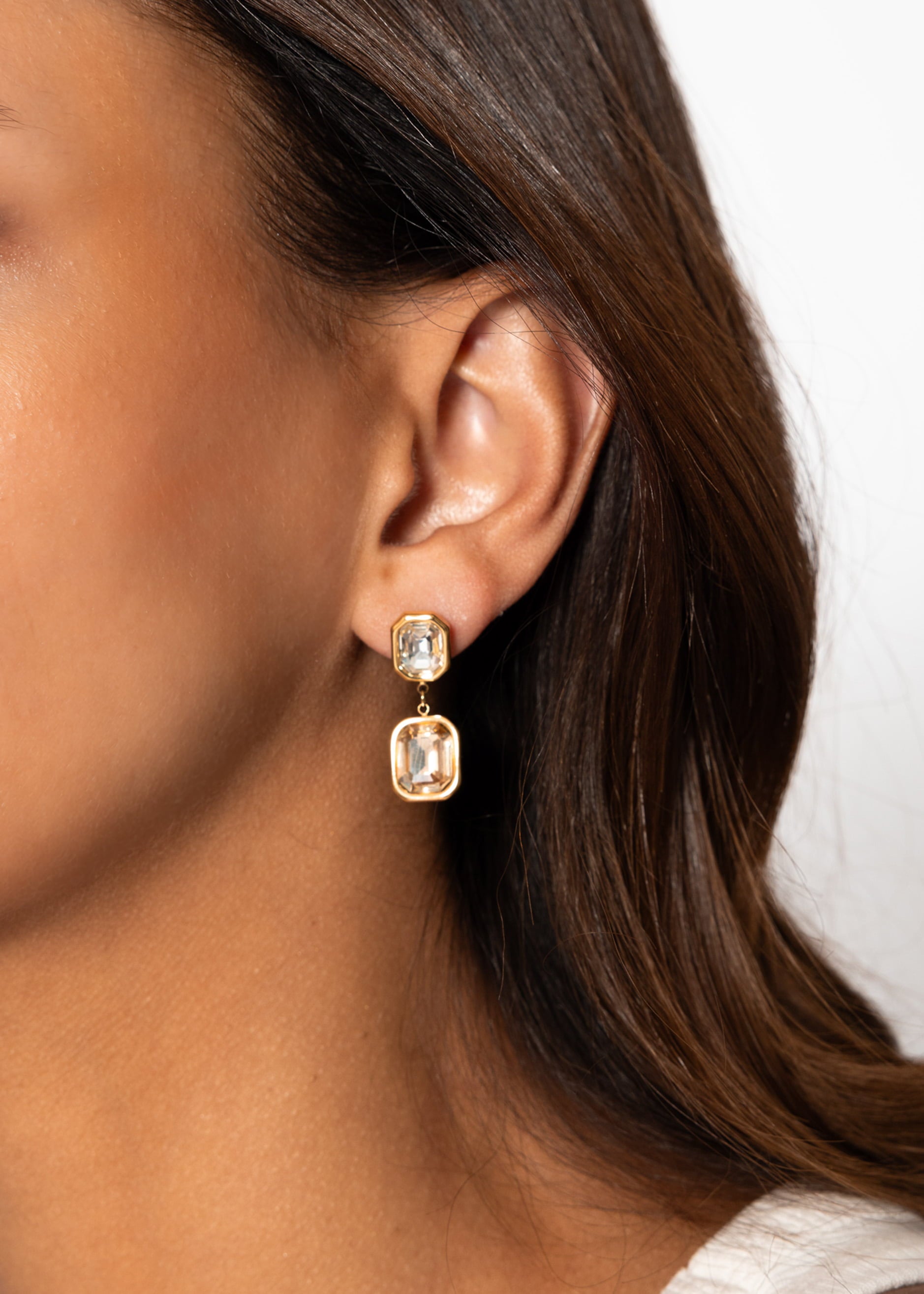 Elegant earrings with light gemstones - gold