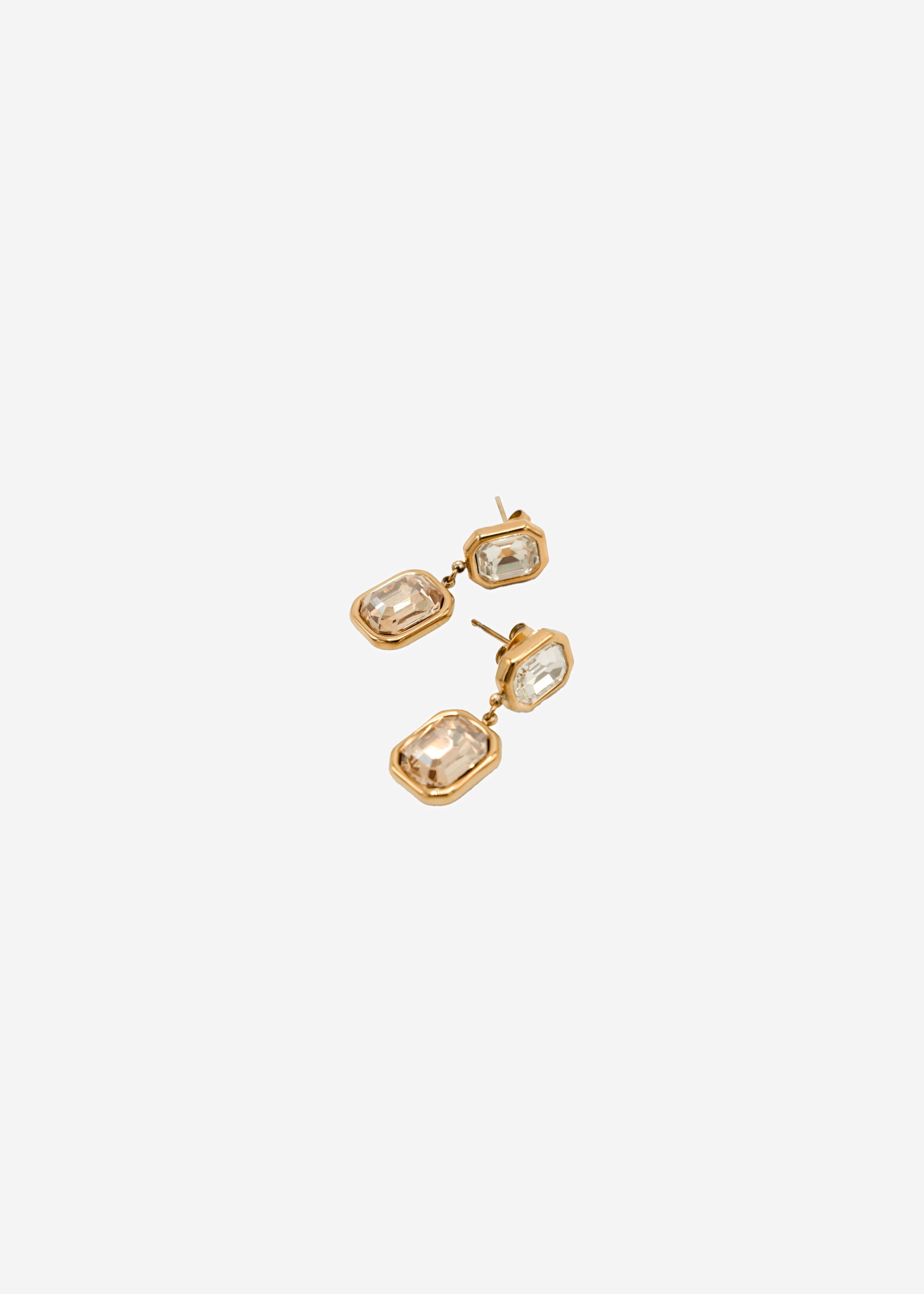 Elegant earrings with light gemstones - gold