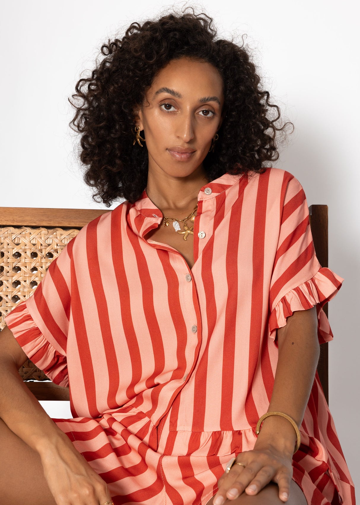 Striped blouse with ruffled hem - red