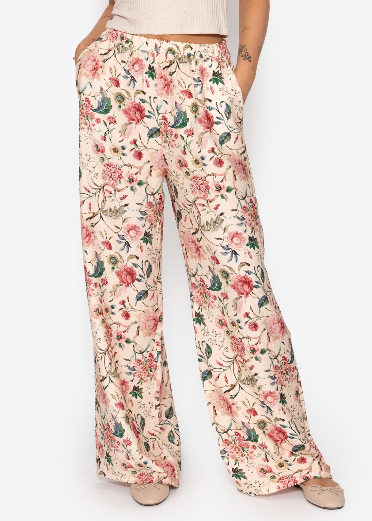 Pants with floral pressure - beige