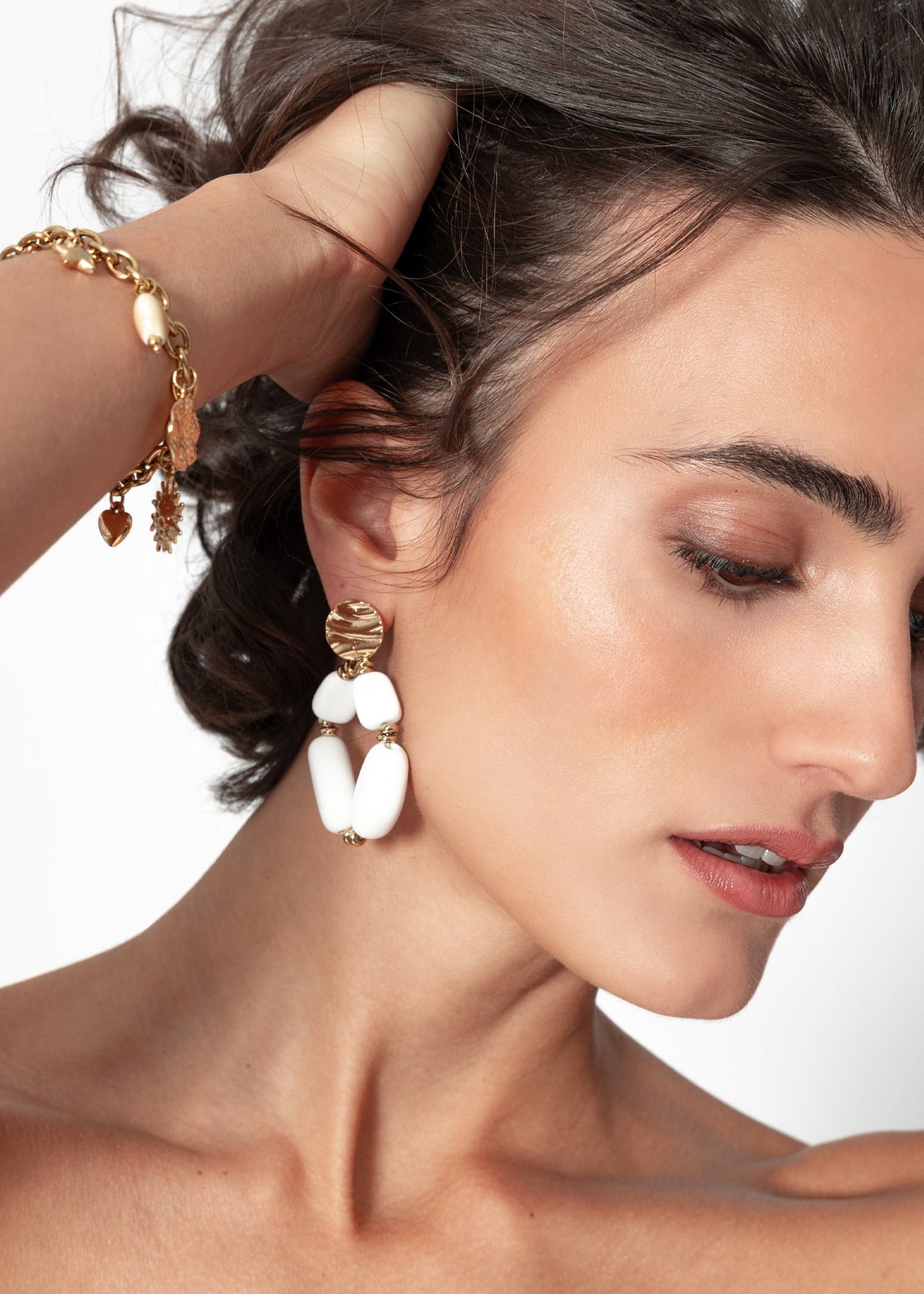 Gold earrings with large pearls, matt white