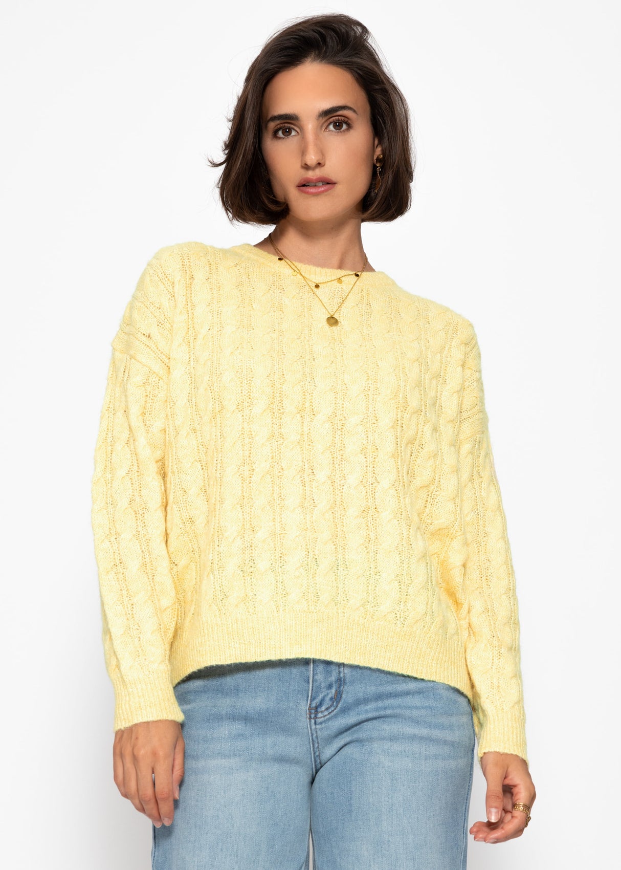 Sweater with a cable pattern - yellow