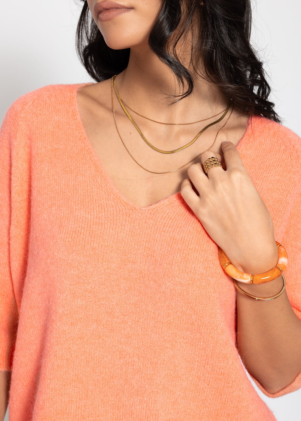 Knitted top with V-neck - coral