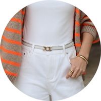 Women's narrow white belt with a gold buckle, paired with white pants – belt by SASSYCLASSY Style
