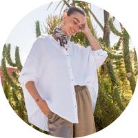 Women's white oversized muslin blouse with a shirt collar and button placket, styled with beige pants and a scarf – white muslin blouses by SASSYCLASSY