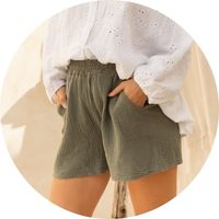 Women's khaki muslin shorts with an elastic waistband and pockets, styled with a white blouse – Muslin shorts by SASSYCLASSY