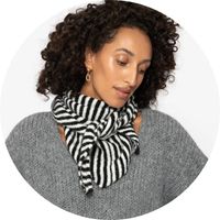 Women's black-and-white striped scarf, styled with a gray knit sweater – Scarves by SASSYCLASSY