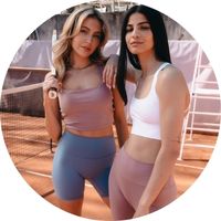 Women's sports tops in dusty pink and white with a figure-hugging fit and wide straps, styled with matching sports shorts – sports tops at SASSYCLASSY