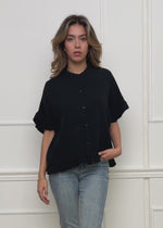 Musselin blouse with ruffled hem - black