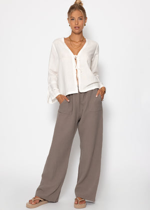 Linen blouse with trumpet sleeves and loop closure - white