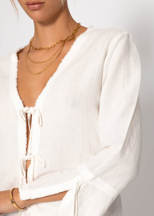 Linen blouse with trumpet sleeves and loop closure - white