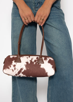 Shoulder bag made of synthetic leather with cow print - brown