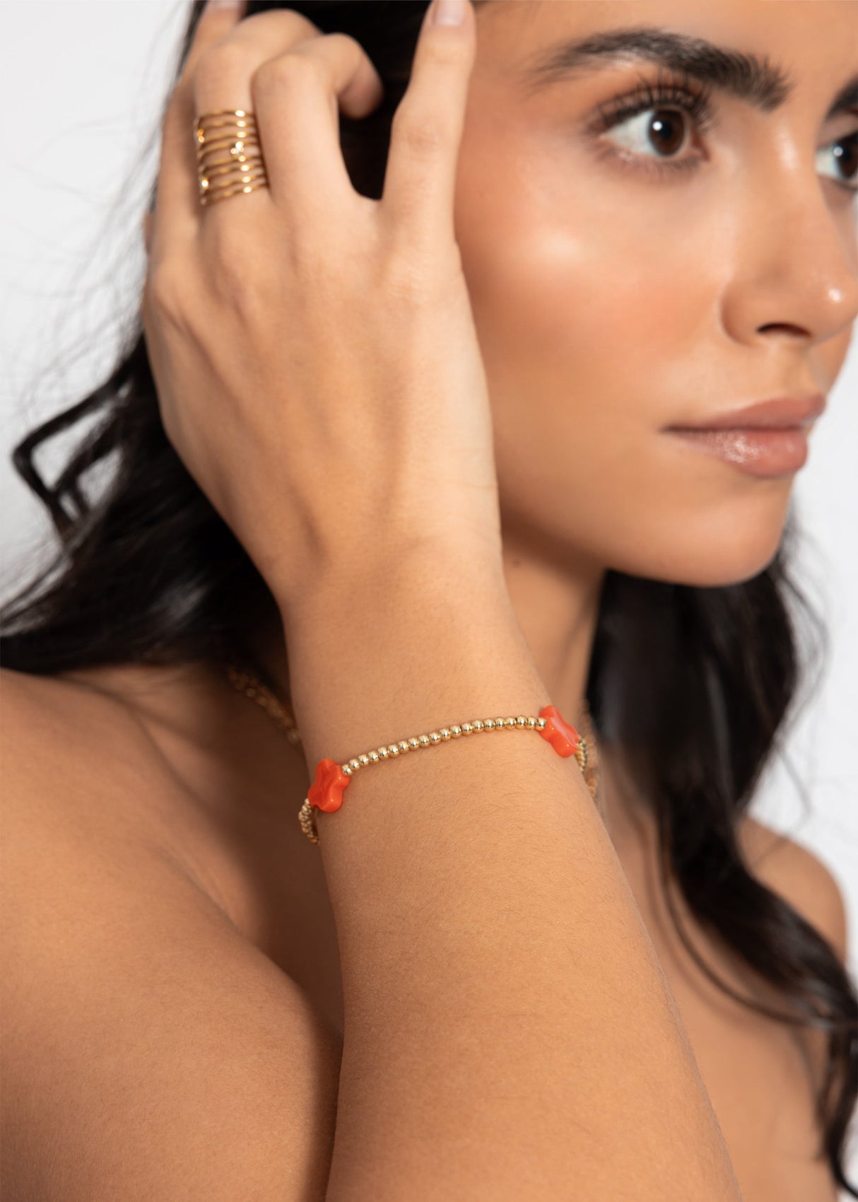 Bracelet with red gemstones - gold