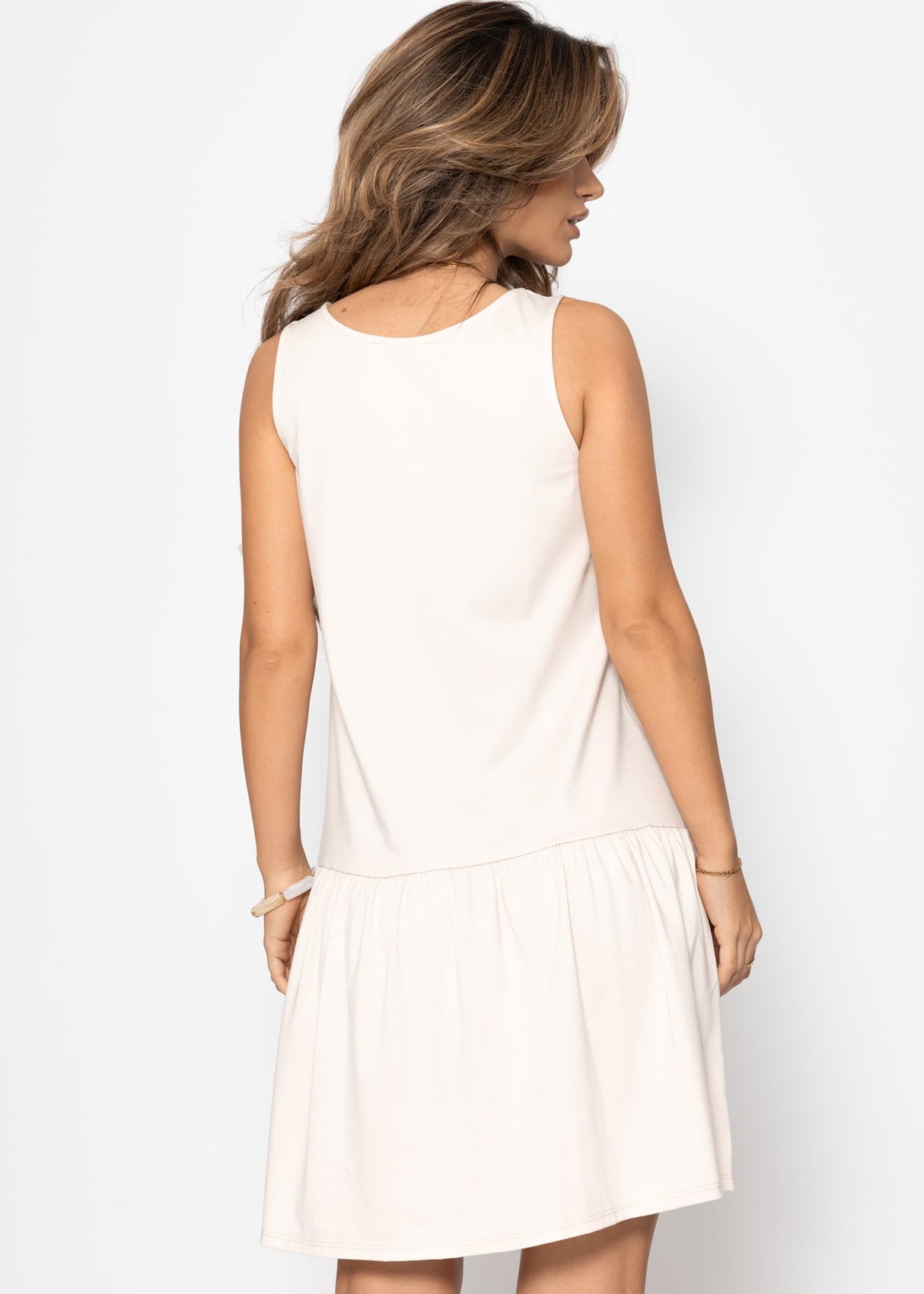 Sleeveless dress with flounce - beige