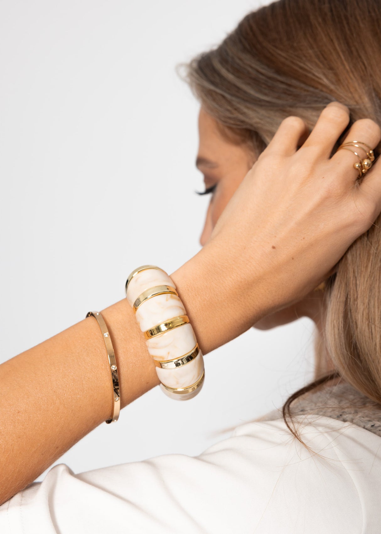 Wide bracelet with gold-colored elements - beige