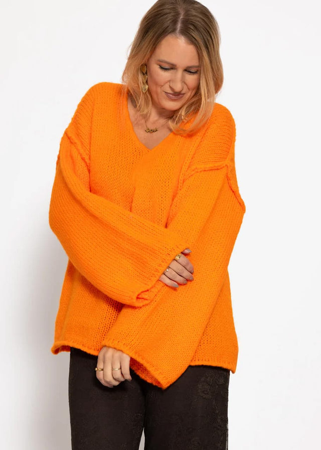 Oversized jumper with V-neck and wide sleeves - orange