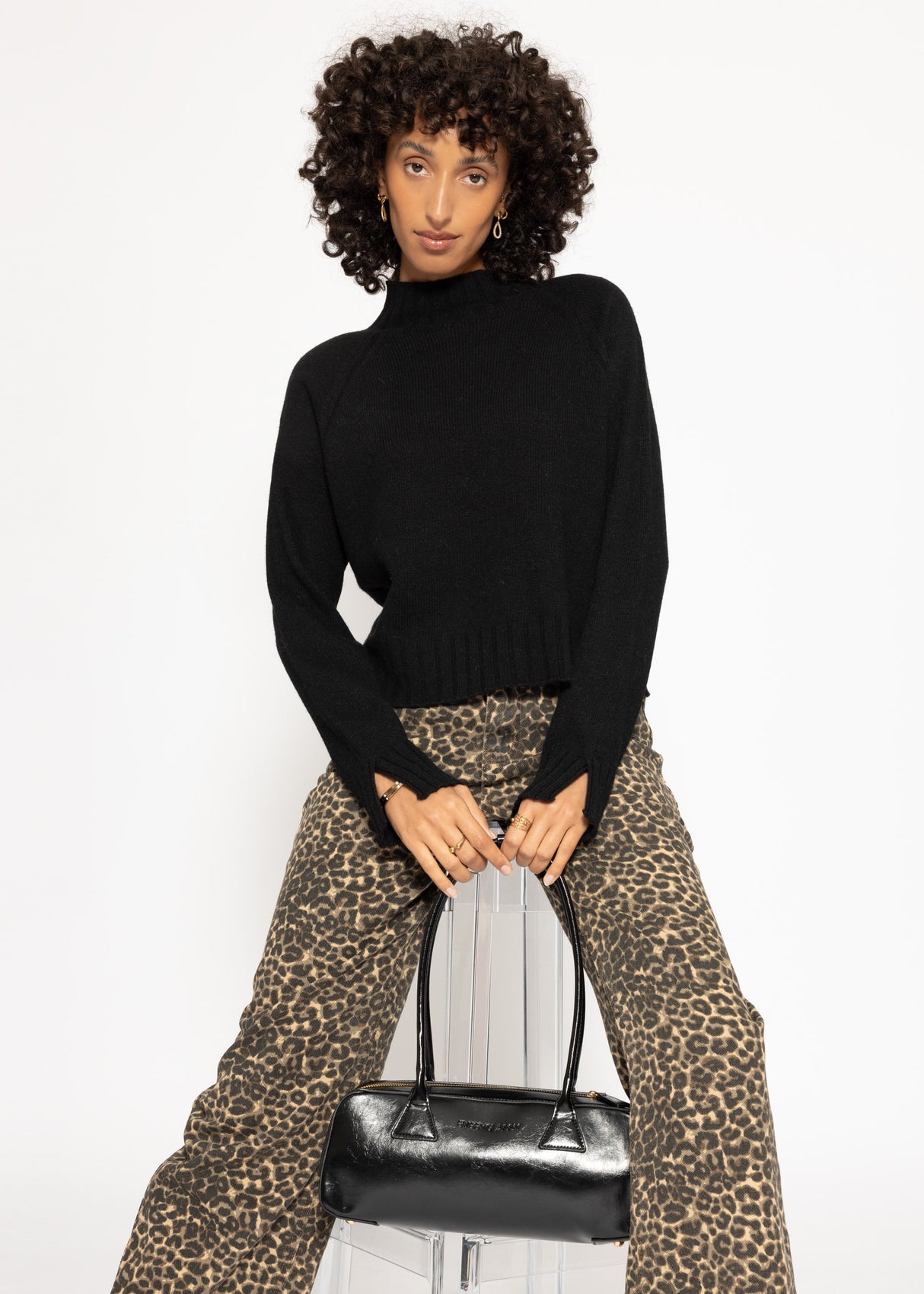 Sweater with stand-up collar and sleeve slits - black
