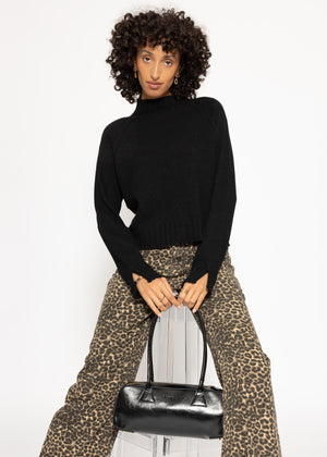 Sweater with stand-up collar and sleeve slits - black