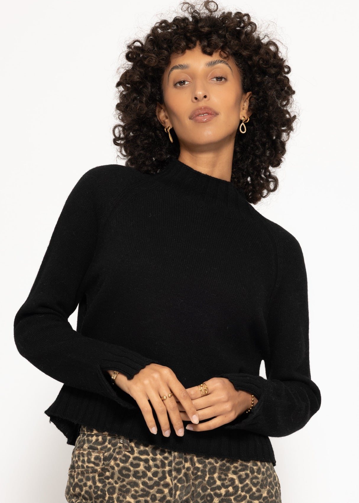 Sweater with stand-up collar and sleeve slits - black