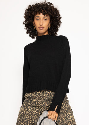 Sweater with stand-up collar and sleeve slits - black