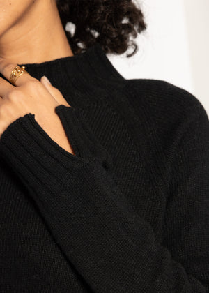Sweater with stand-up collar and sleeve slits - black
