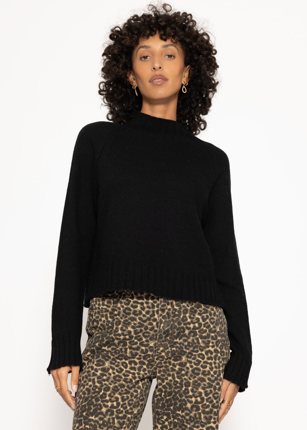 Sweater with stand-up collar and sleeve slits - black
