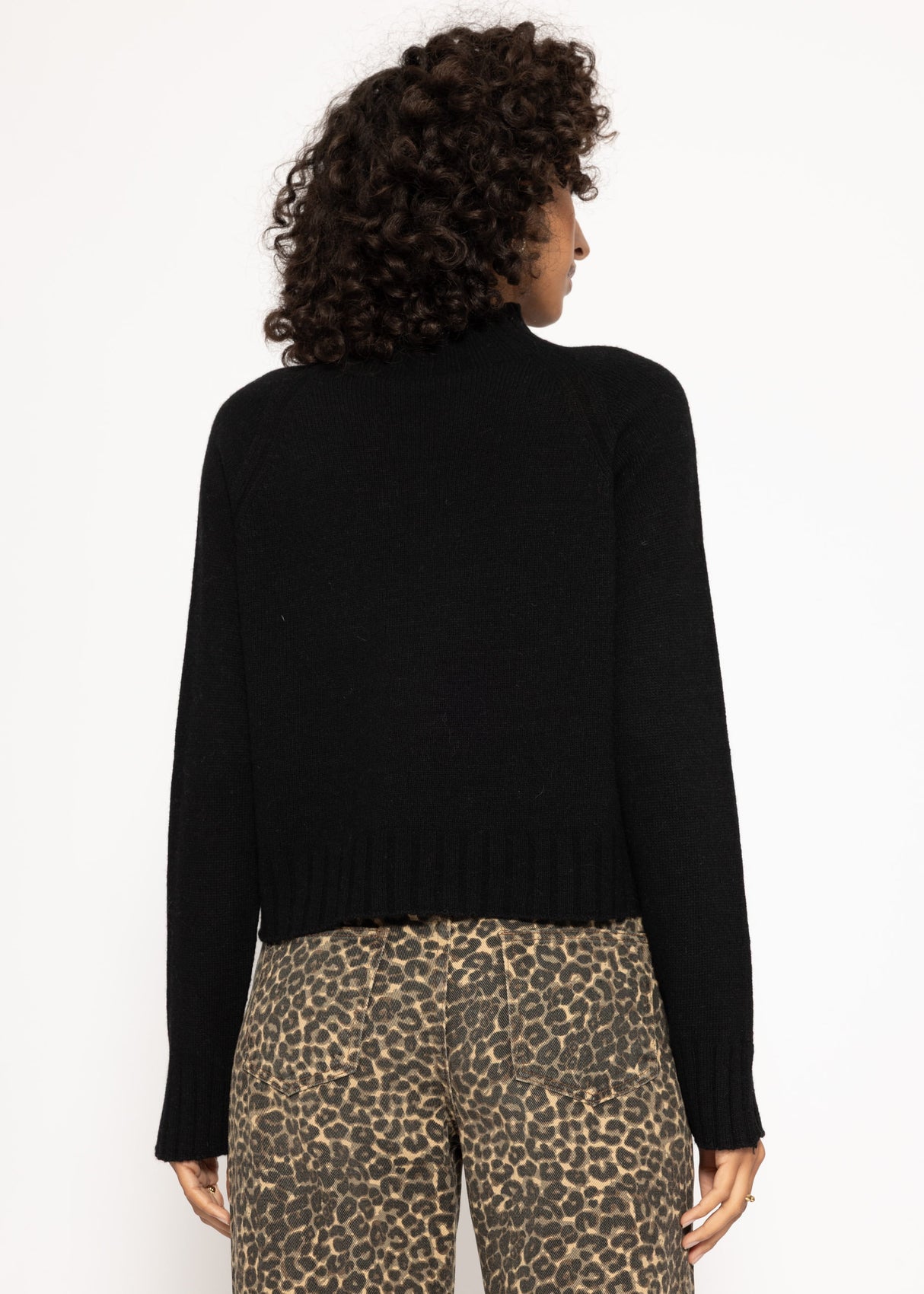 Sweater with stand-up collar and sleeve slits - black
