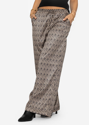 Wide-legged trousers with geometric print and elastic waistband - beige