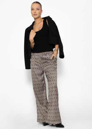 Wide-legged trousers with geometric print and elastic waistband - beige
