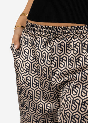 Wide-legged trousers with geometric print and elastic waistband - beige