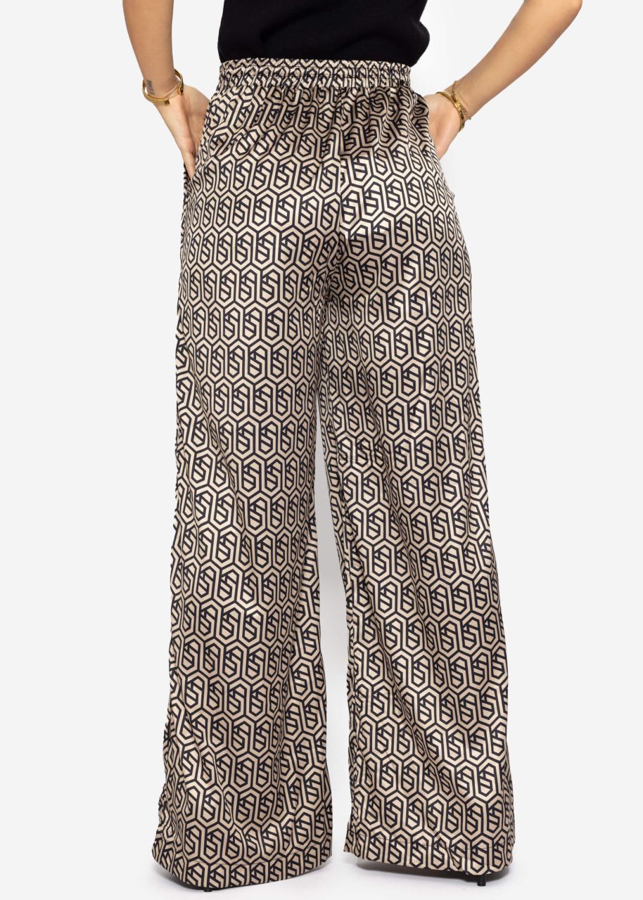 Wide trousers with geometric print and elastic waistband - beige