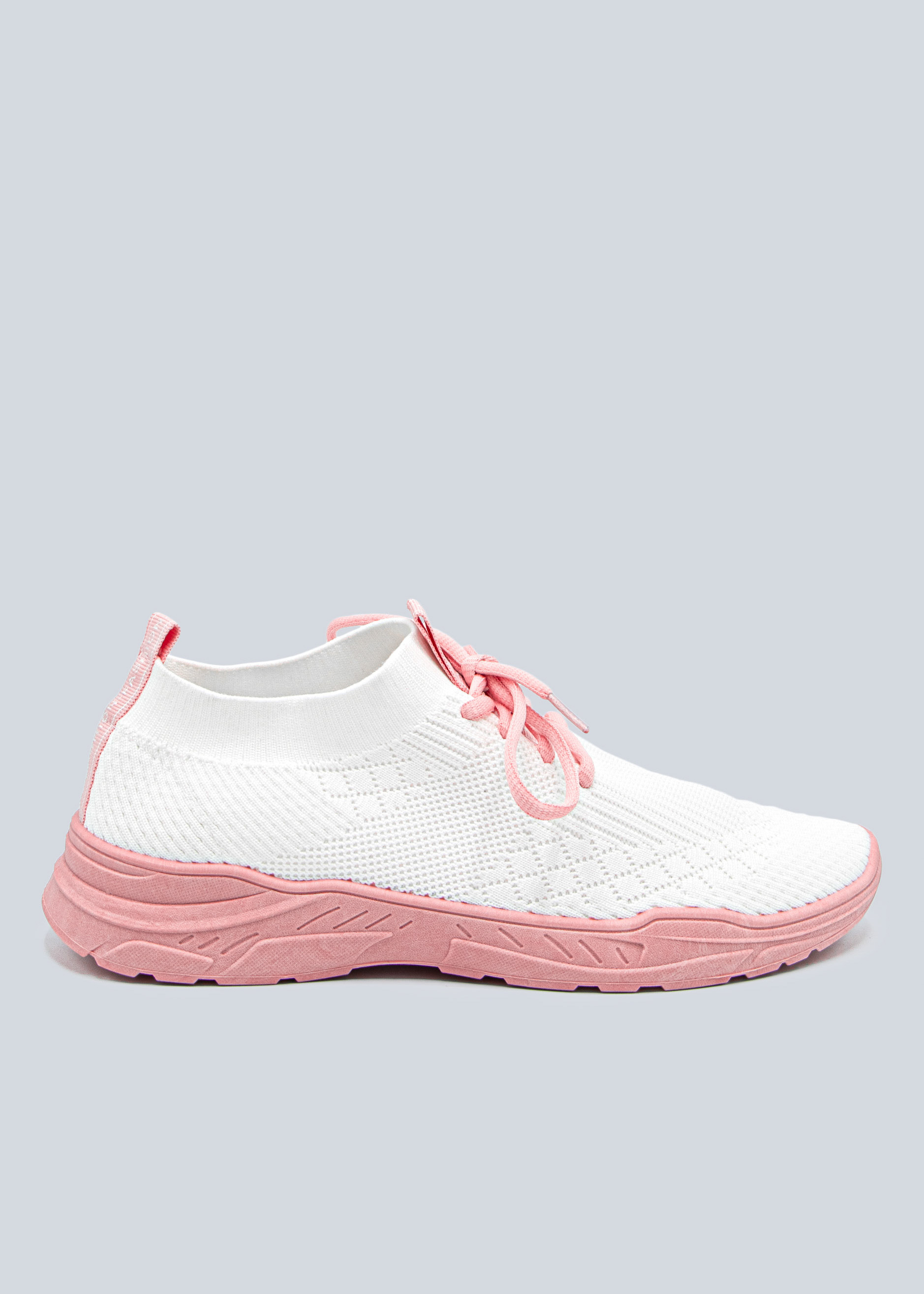 white sneakers with pink soles