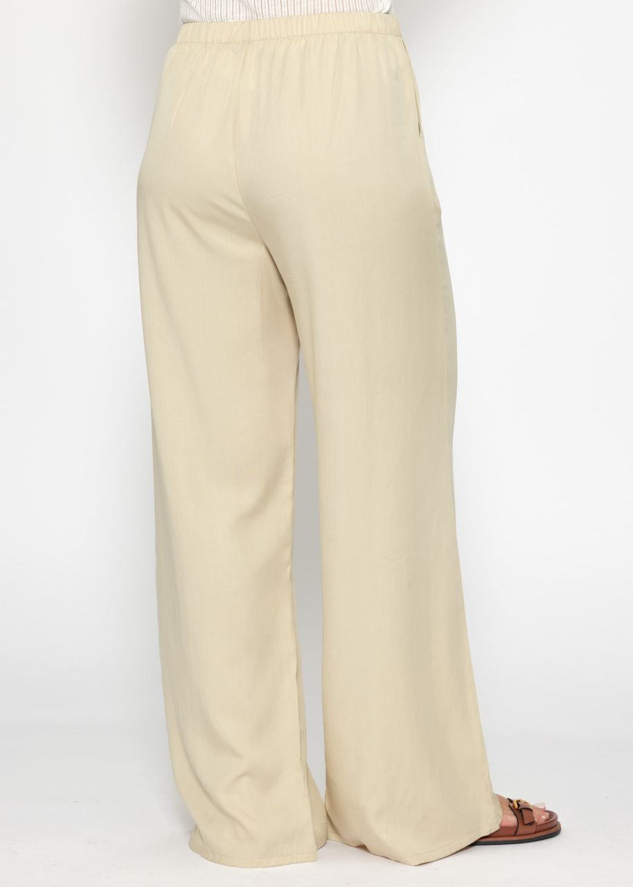 Trousers with wide leg and ruffle detail - beige