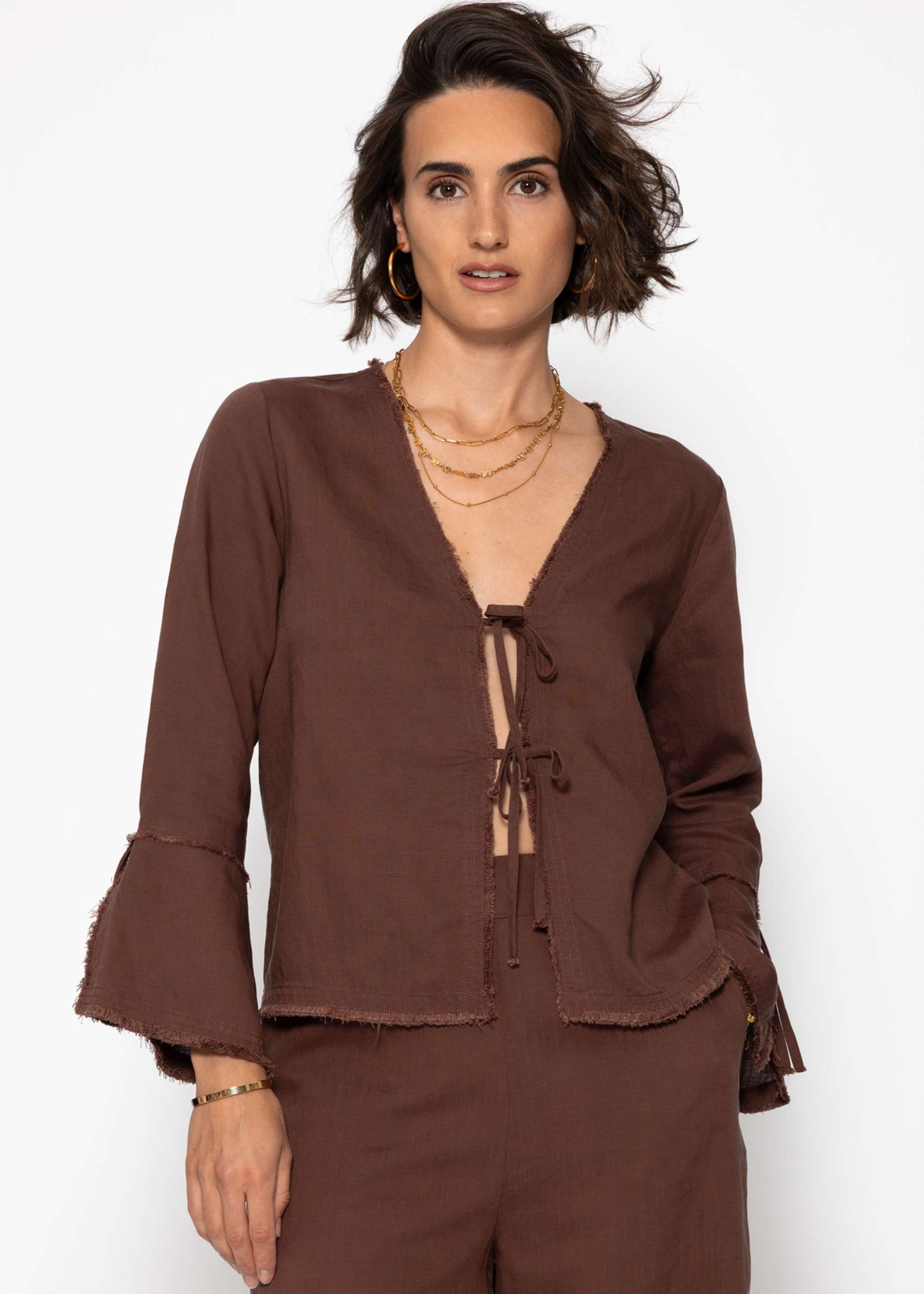 Linen blouse with trumpet sleeves and bow fastening - brown