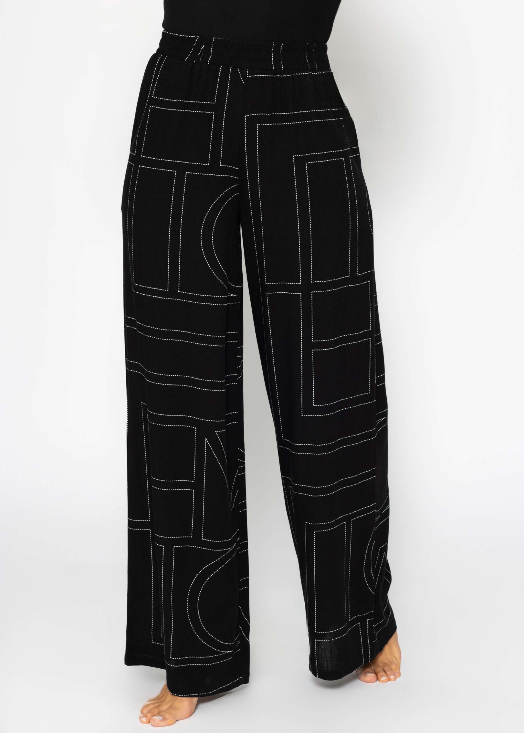 Slip-on trousers with print - black