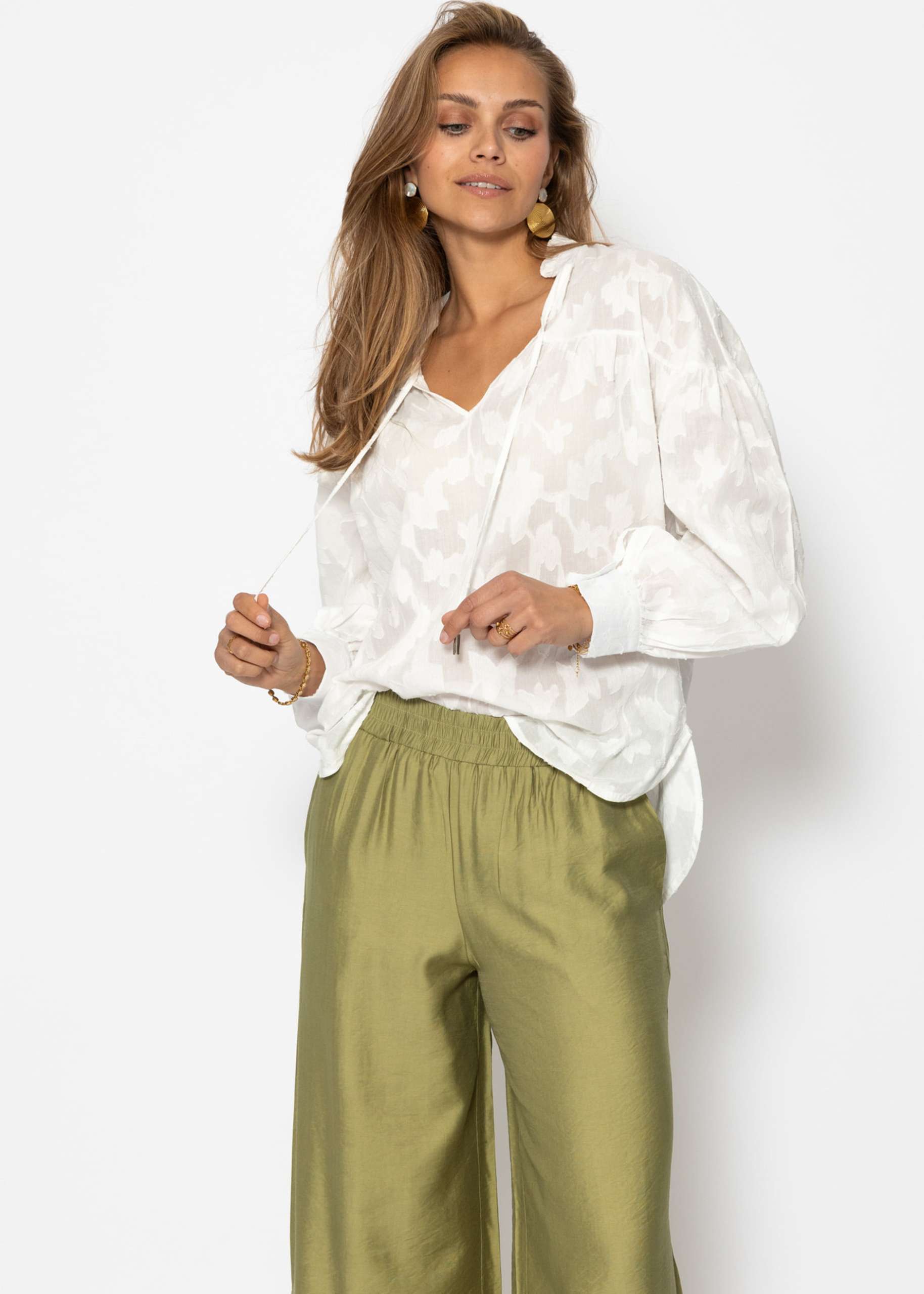Slightly transparent jacquard blouse with tie detail