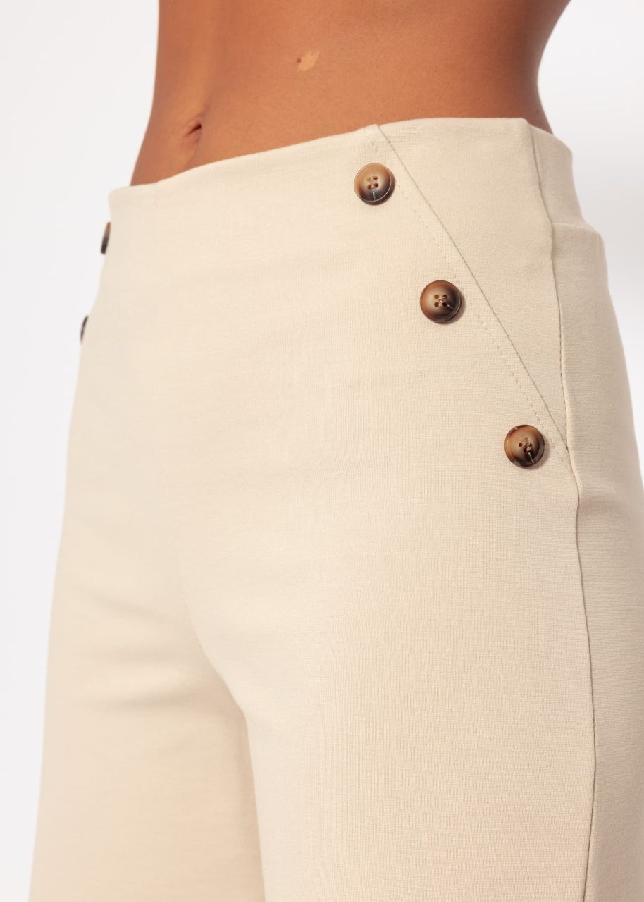 Trousers with decorative buttons - beige