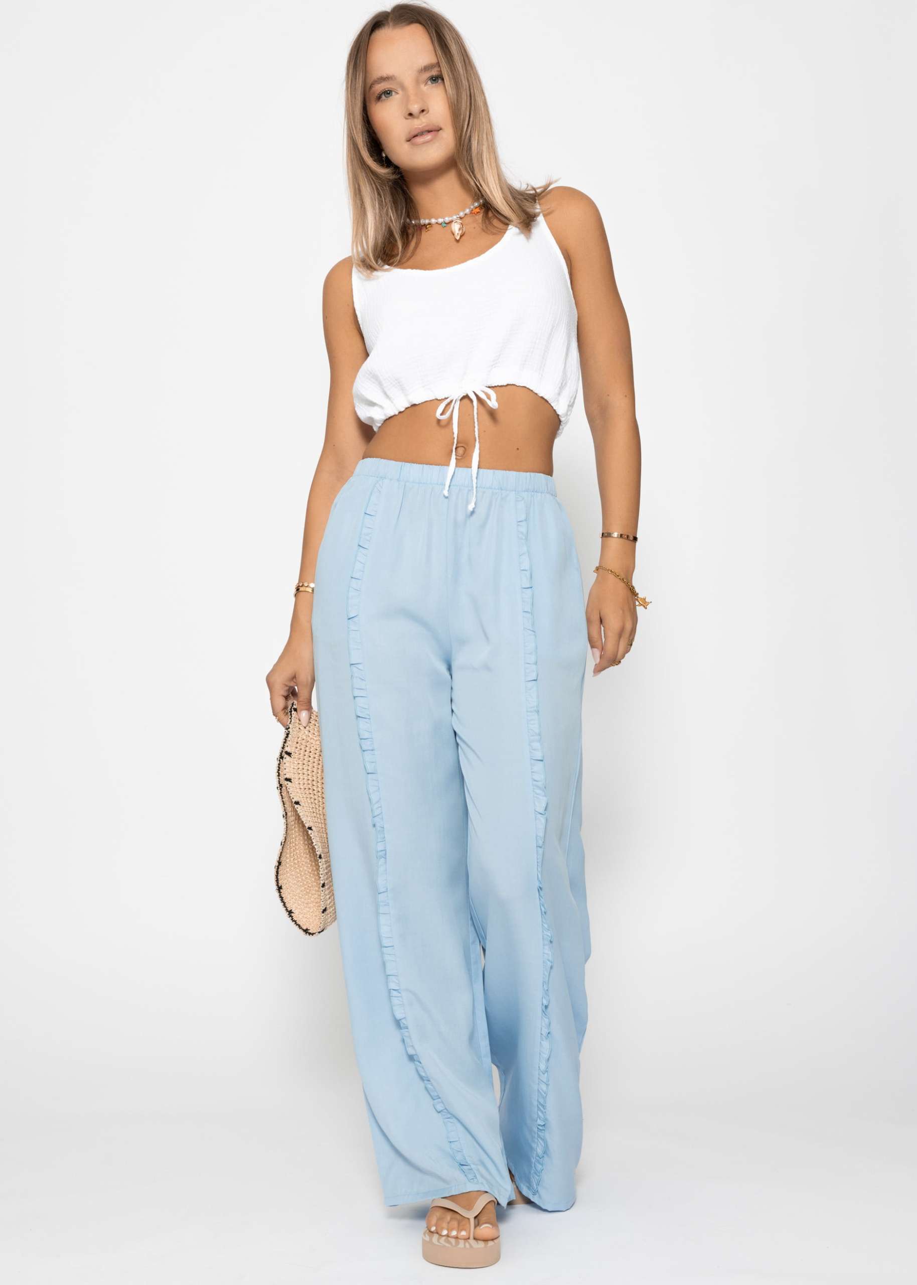 Trousers with wide leg and ruffle detail - light blue